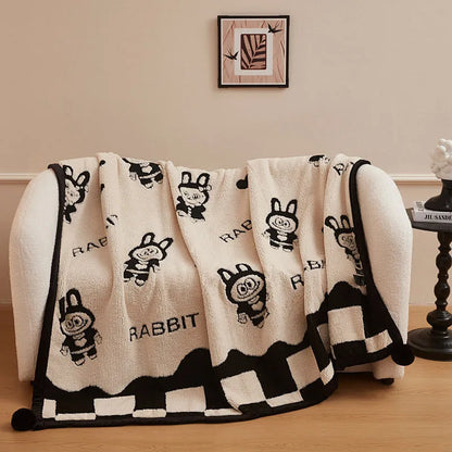 Black and white cationic panda pattern velvet blanket showing texture and modern design