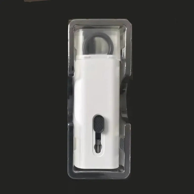 White electronics cleaning kit with a cleaning pen, spray bottle, brush, and keycap puller on a table