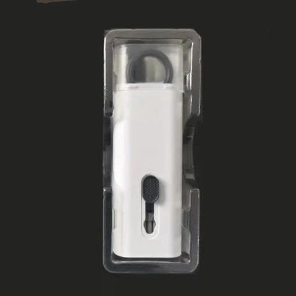 White electronics cleaning kit with a cleaning pen, spray bottle, brush, and keycap puller on a table