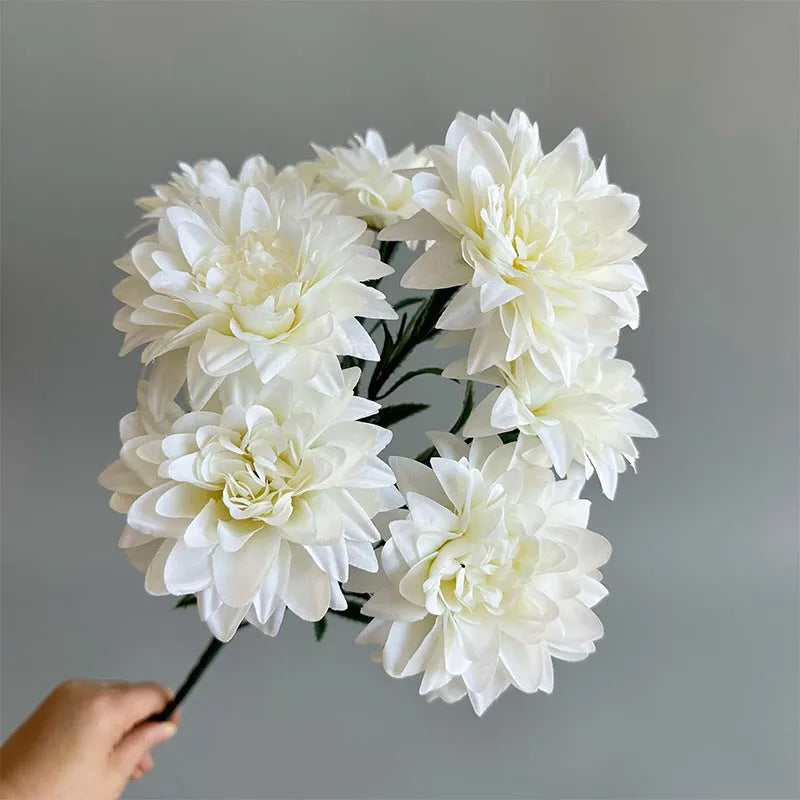 Desktop fan-shaped display holding artificial silk flowers in rose and peony varieties with colourful petals