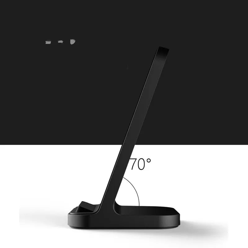 Dark grey vertical aluminium wireless charging stand for iPhone on a desk