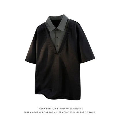 Man wearing a black henley collar short sleeve spandex pullover sweater.