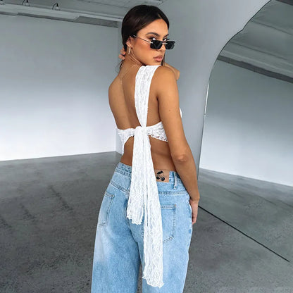 Women's backless lace vest top with asymmetrical neckline in solid colour.