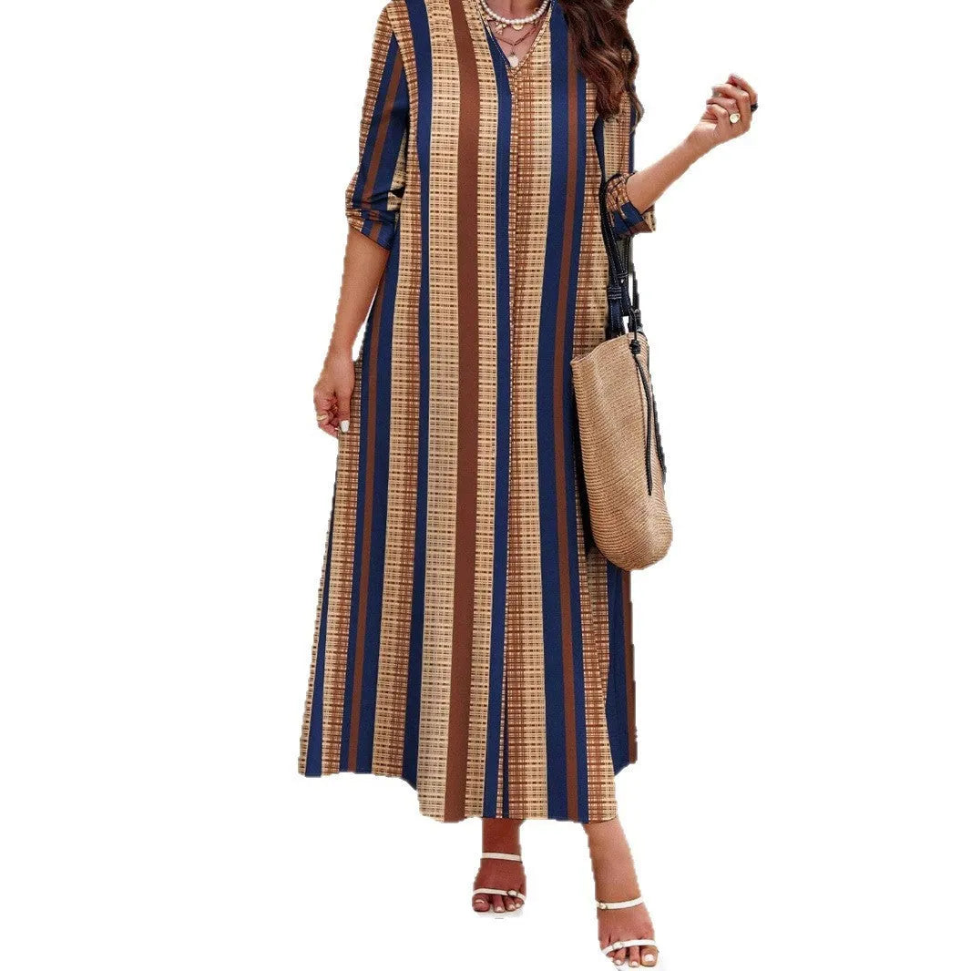 Camel coloured vertical striped V-neck knitted long sleeve dress on a hanger.