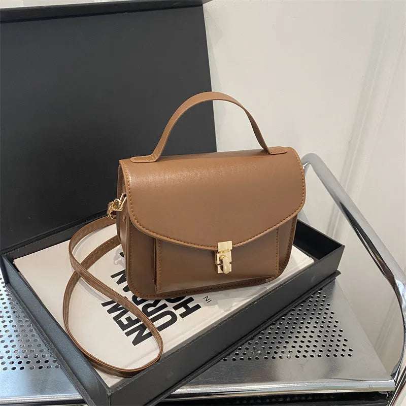 A horizontal square-shaped PU leather shoulder messenger bag in a choice of colours, showing the document compartment interior.