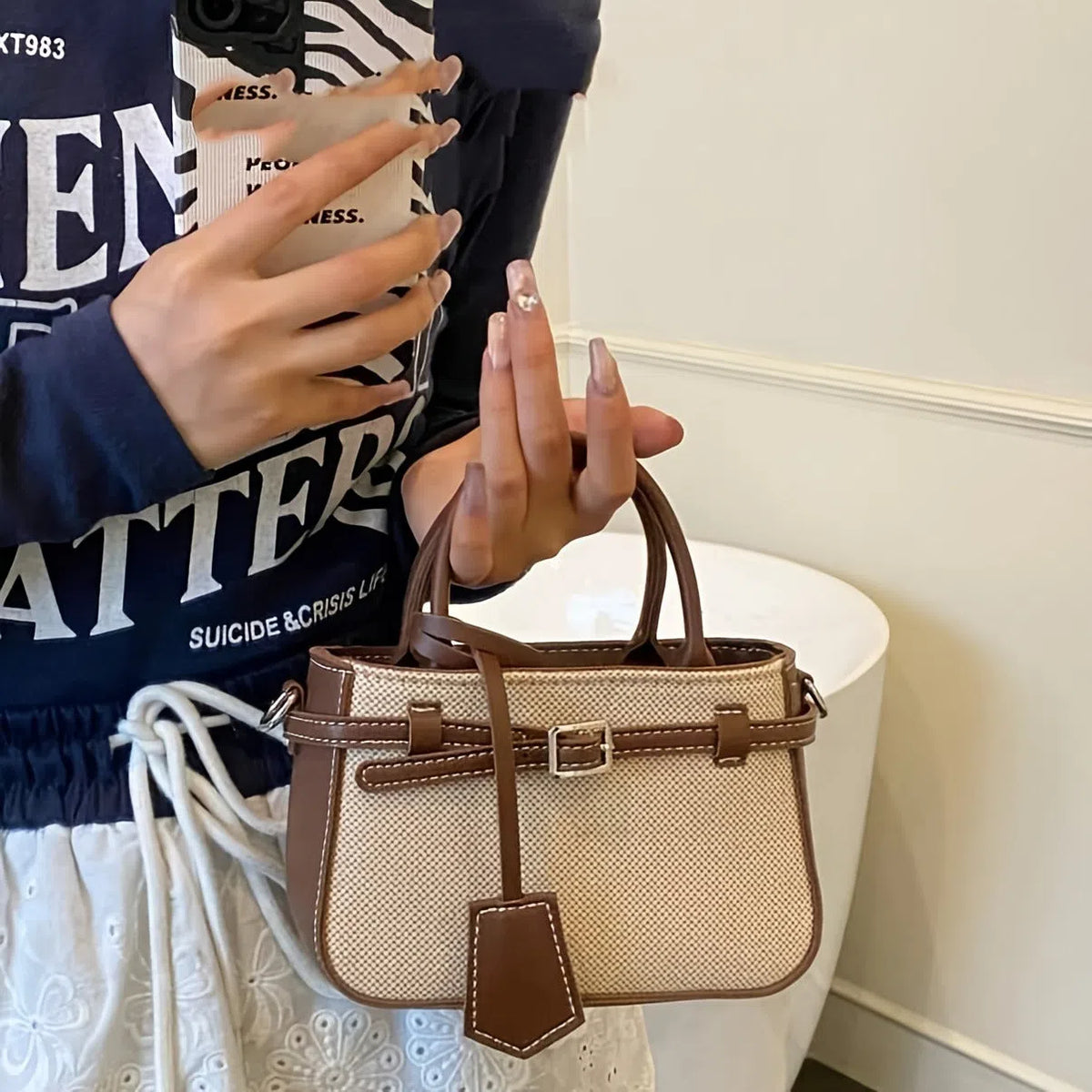 Brown PVC crossbody tote bag with suede lining, single strap, 17.5 x 11.5 x 7.5 cm vertical rectangular shape.
