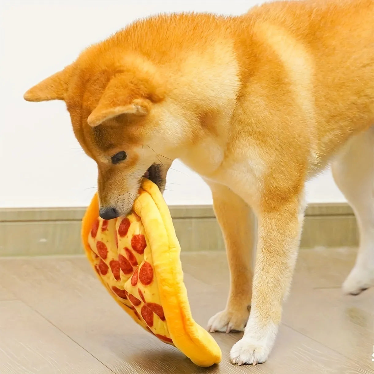 Yellow pizza slice dog chewing toy with teddy bear texture and squeaker