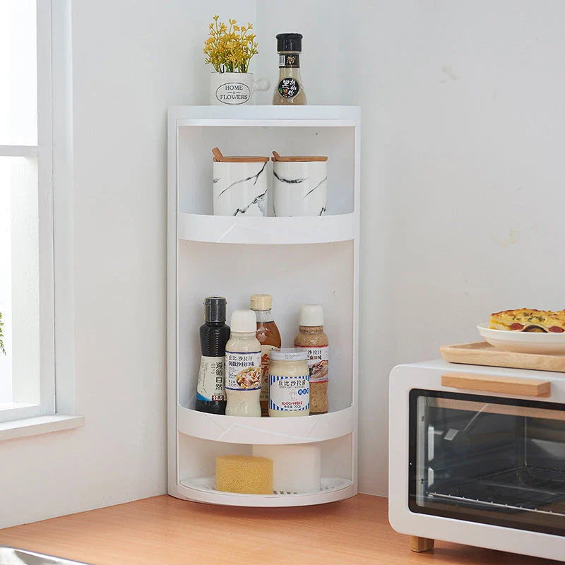 Rotating bathroom makeup storage rack with covered front, disassemblable base, and wall-mounting for space-saving organization.