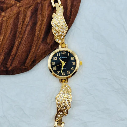 Stainless steel women's watch with round dial and vachette clasp on wrist.