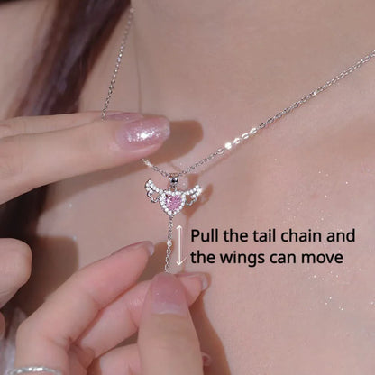 Elegant angel wings necklace with moving heart pendant, made of titanium steel and crystal accents
