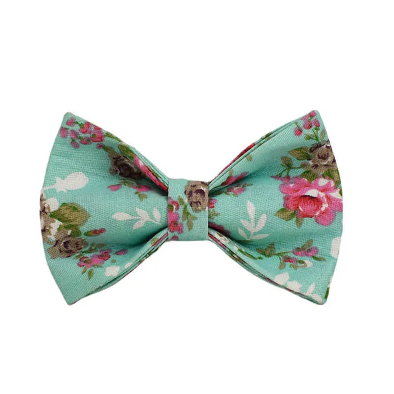 Rose and green cloth dog collar set with detachable bow, matching leash, and vest
