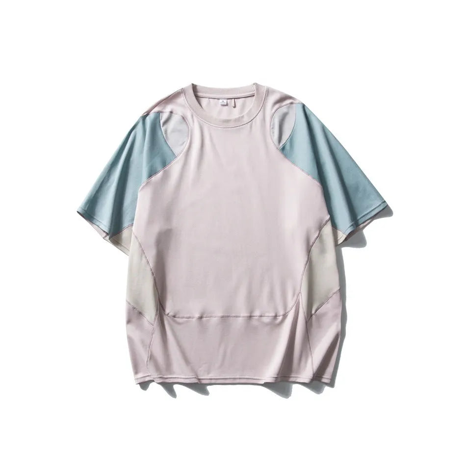 Man wearing a loose blue patchwork contrast colour short sleeve cotton blend sports t-shirt.