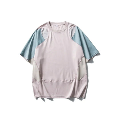 Man wearing a loose blue patchwork contrast colour short sleeve cotton blend sports t-shirt.