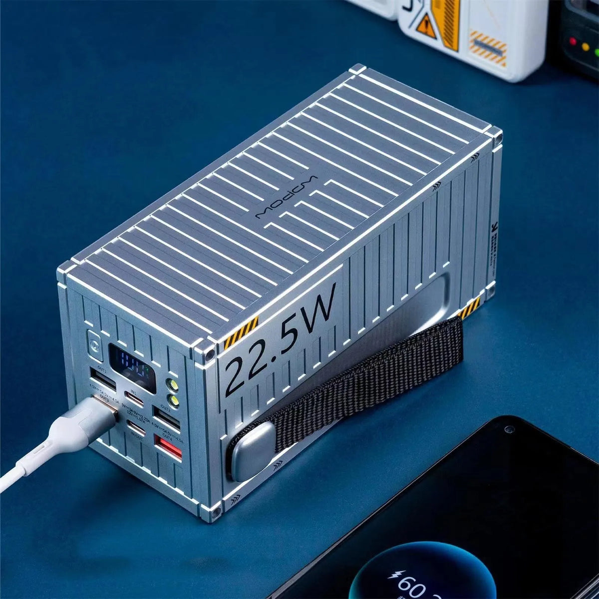 Yellow 50000mAh portable power bank with digital display showing battery percentage and five output ports.