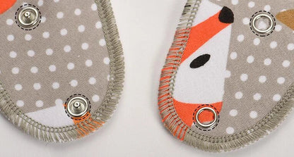 Set of four cotton baby bibs with arrow and wave designs for mess-free feeding