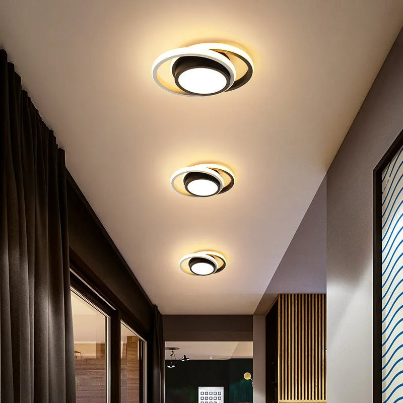 Modern geometric aluminium ceiling light in round and square styles with LED illumination.