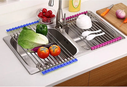 Folding stainless steel kitchen drain rack with coloured plastic tubes, shown open for use.