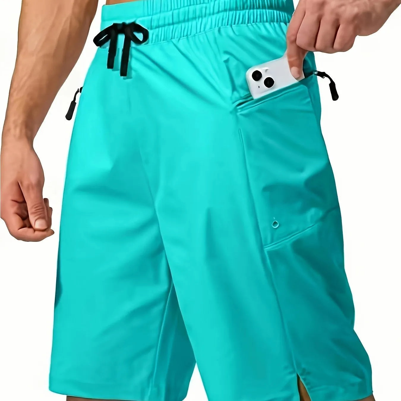 Man wearing solid colour straight-leg beach shorts in quick-dry polyester fabric.