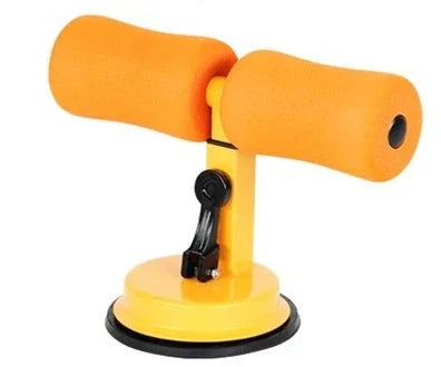 Compact sit-up strength trainer with steel springs and foam padding for home fitness