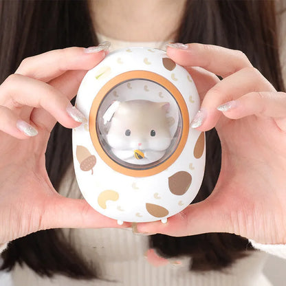 White Hamster space capsule design hand warmer and 5000mAh USB power bank unit.