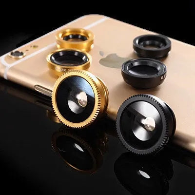 Three-in-one mobile phone camera lens kit showing fisheye, wide-angle, and macro lenses with universal clip in assorted colours.