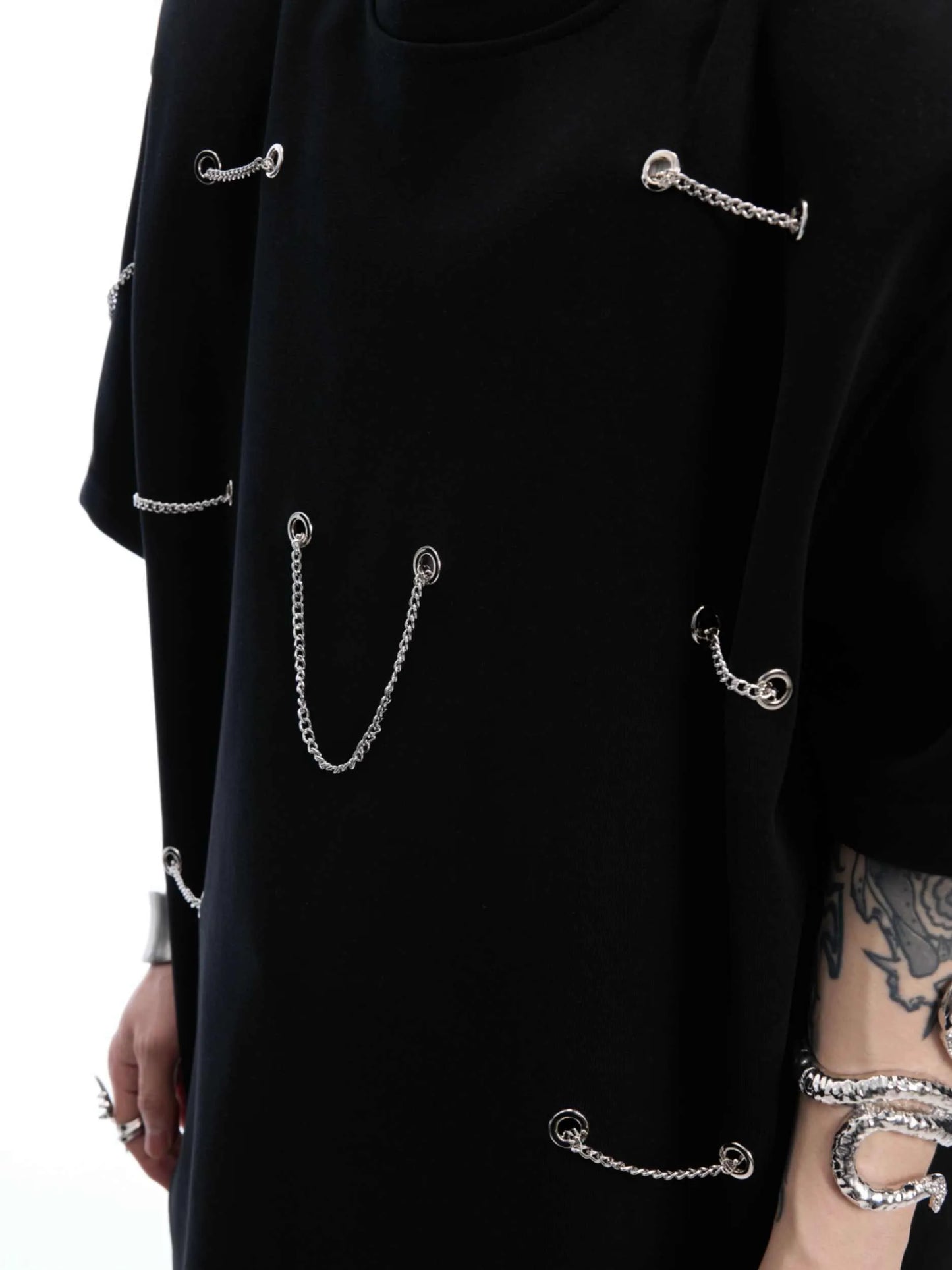 Black men's t-shirt with metal chain and padded shoulder detail on a short sleeve cotton-polyester blend.