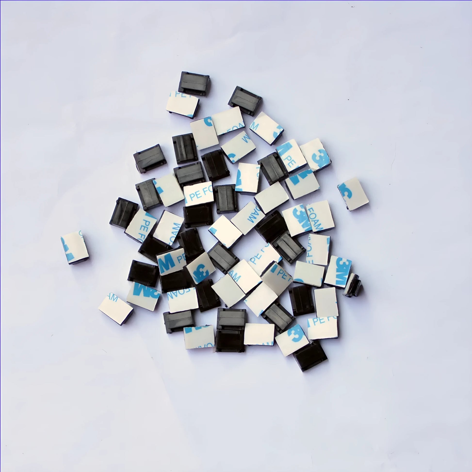 Black PA66 nylon car wire retaining clip for managing automotive and LED electronic cables.