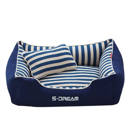 Removable washable dog kennel mat with fabric pillow in navy stripes and blue or red colour options.