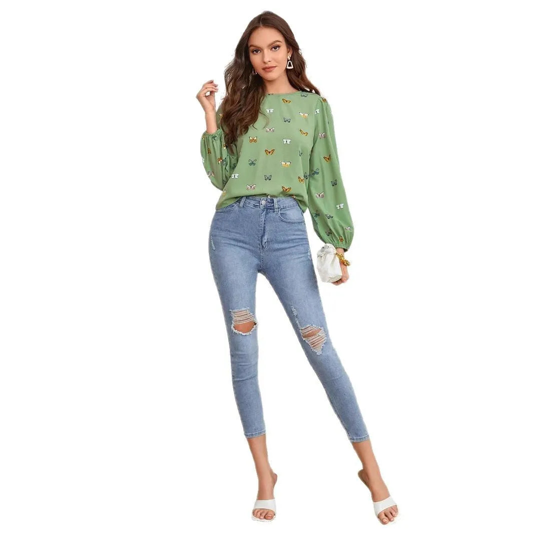 Women's butterfly print long-sleeved shirt in loose fit available in green or orange colours