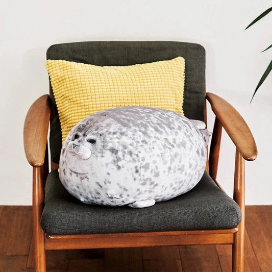 A plush, lifelike seal cushion in various sizes and colours, made of soft velvet fabric and PP cotton filling