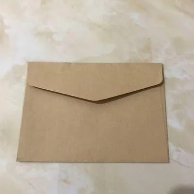 Mini coloured paper envelopes in various hues measuring 11.5 by 8 centimetres
