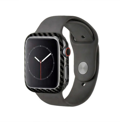 Apple Watch Series 4 in a black carbon fibre case with a leather half-wrap on a wrist