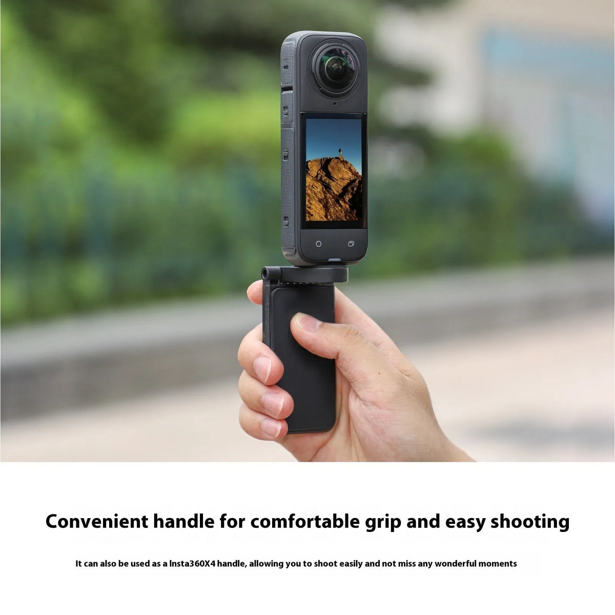 Black magnetic bracket base and handle accessory for an Insta360 X4 camera on a desktop.
