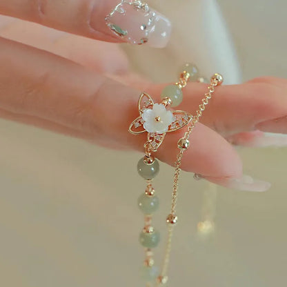 Yellow gold electroplated copper butterfly bracelet with geometric shapes for women