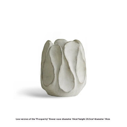 Hand-formed irregular ceramic vase measuring 25cm tall with 15cm diameter opening, made from magnesium clay