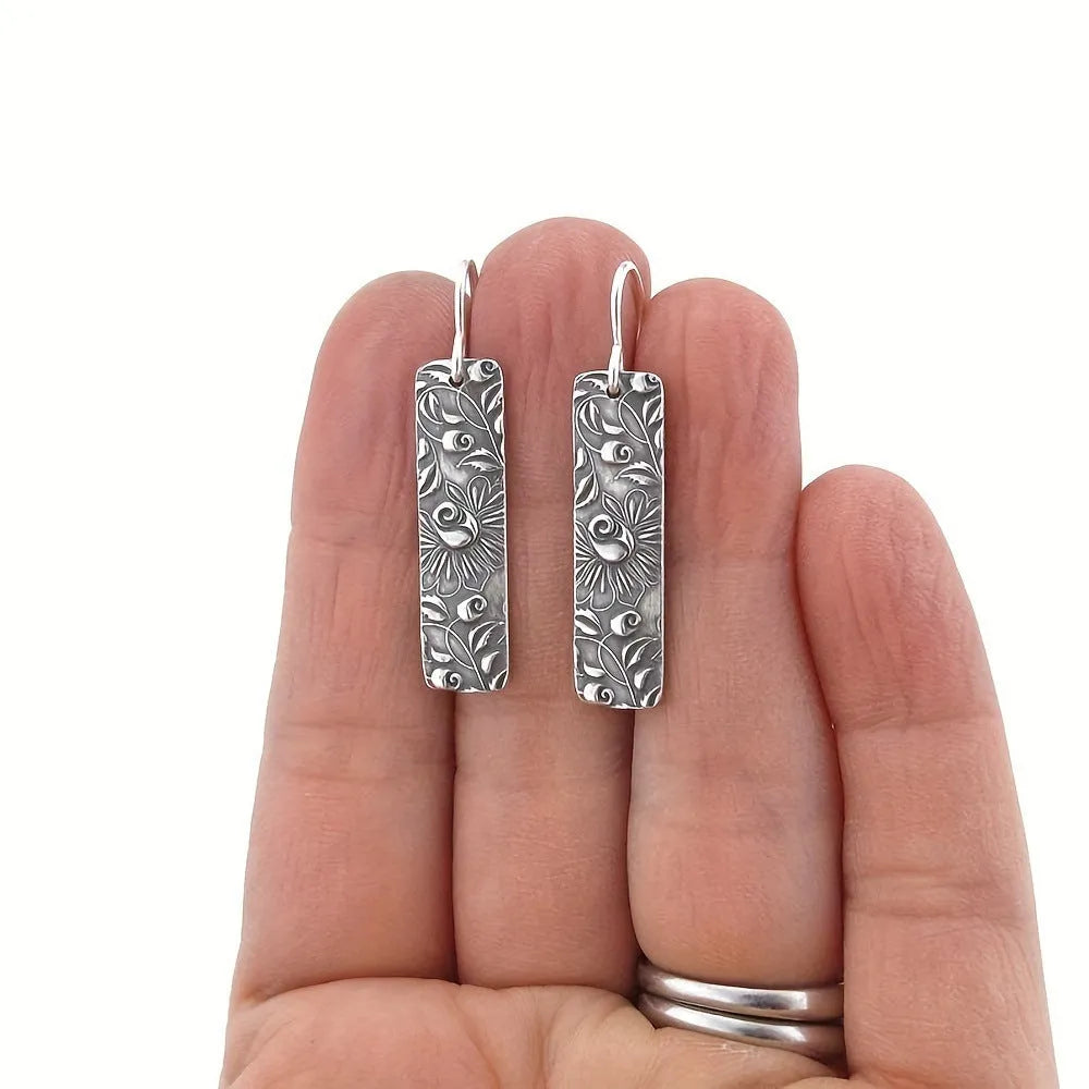 Geometric long earrings with carved vine pattern in silver zinc alloy