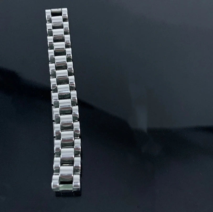 Elegant titanium steel bracelet watch with adjustable, geometric design in gold and stainless steel colours