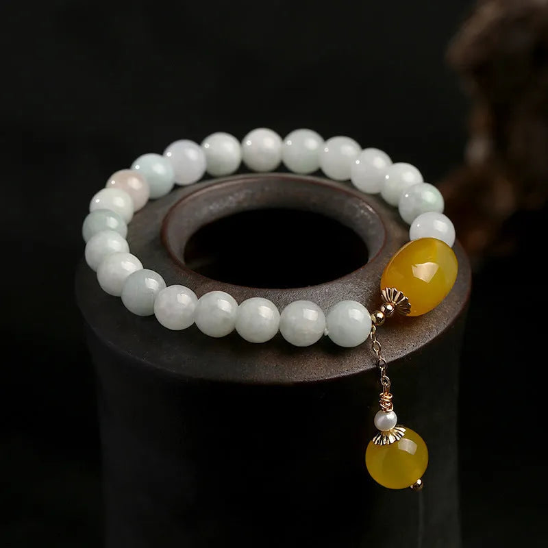 Geometric women's bracelet with hanging agate tassel and 14K gilded elements