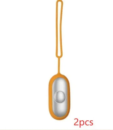Hand-held micro-current sleep aid device in grey, green, or orange with round button and USB charging port