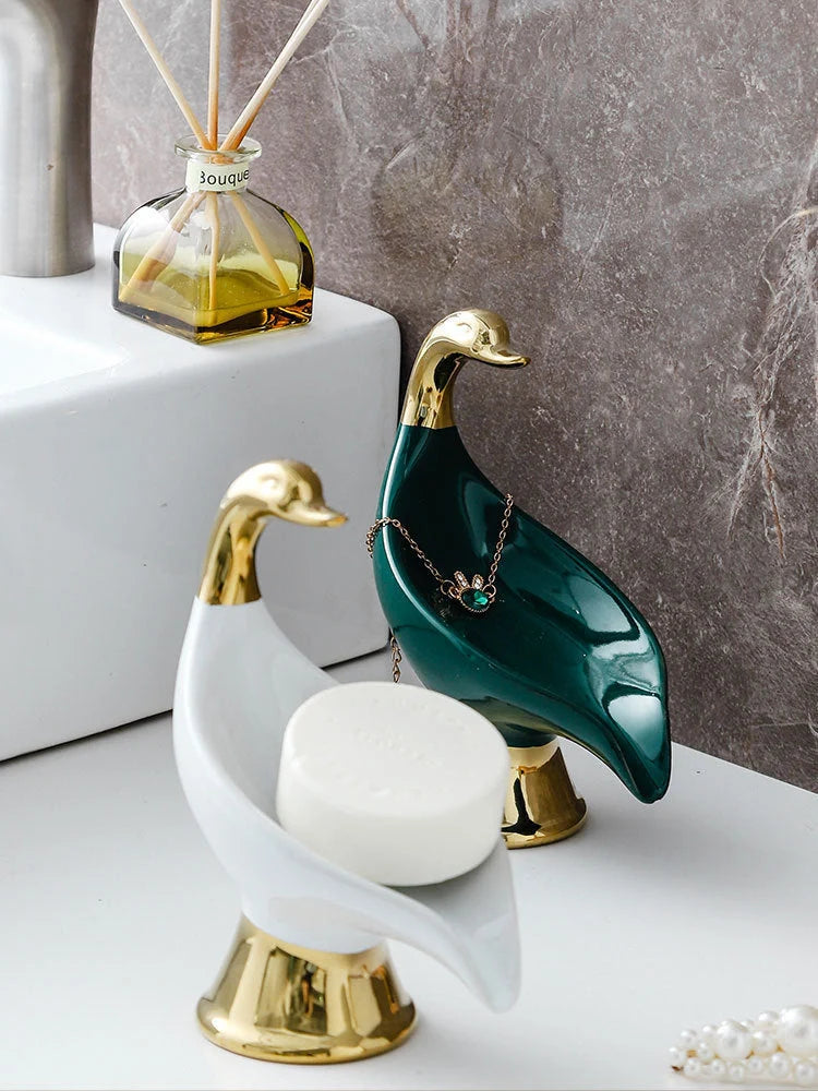 Ceramic swan soap rack in white and green, featuring a drainage cover