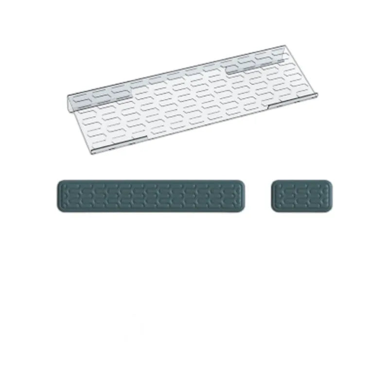 Double-sided black and grey keyboard mouse pad with wrist strap and hand pillow on a desk.