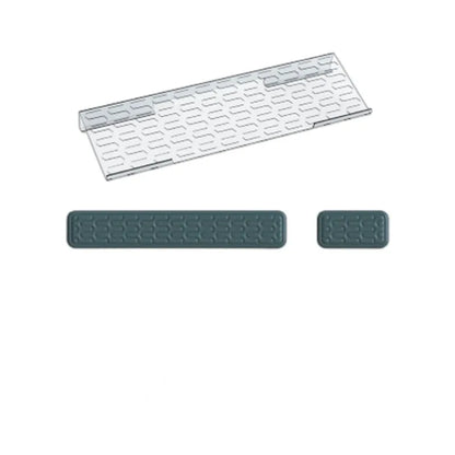 Double-sided black and grey keyboard mouse pad with wrist strap and hand pillow on a desk.