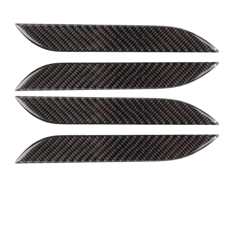 Set of four carbon fibre texture adhesive door handle protectors for Tesla Model S interior.