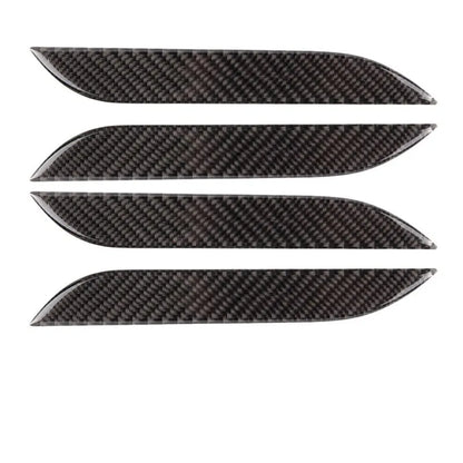 Set of four carbon fibre texture adhesive door handle protectors for Tesla Model S interior.