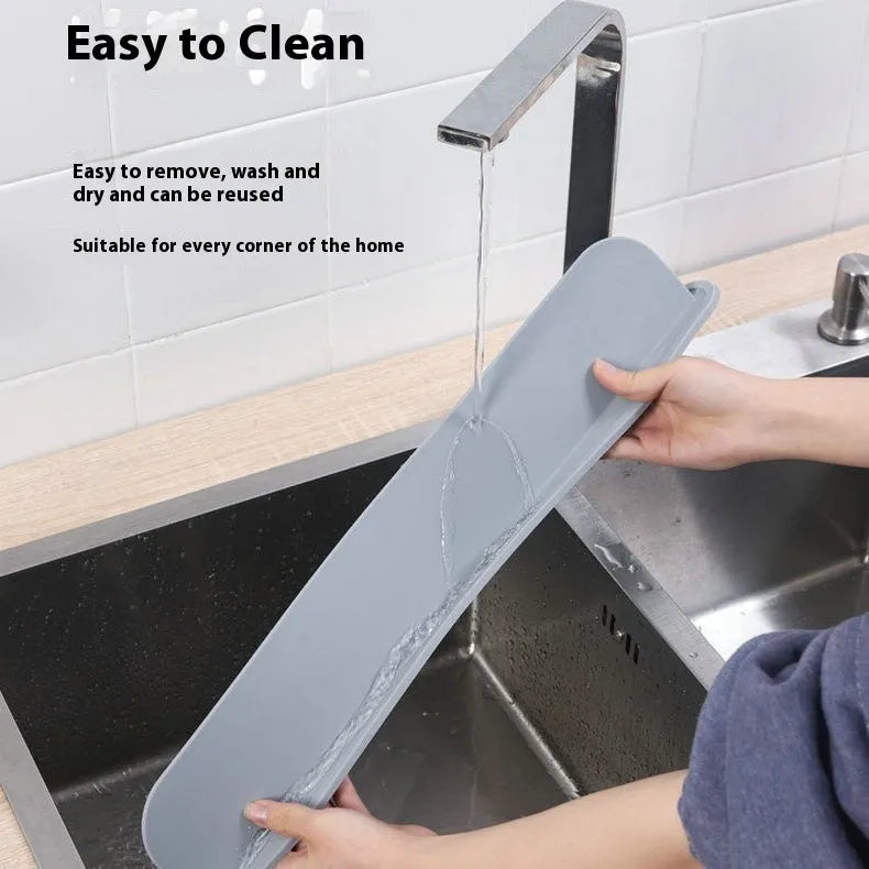 Grey-blue silicone kitchen sink water blocking plate measuring 52mm by 85mm