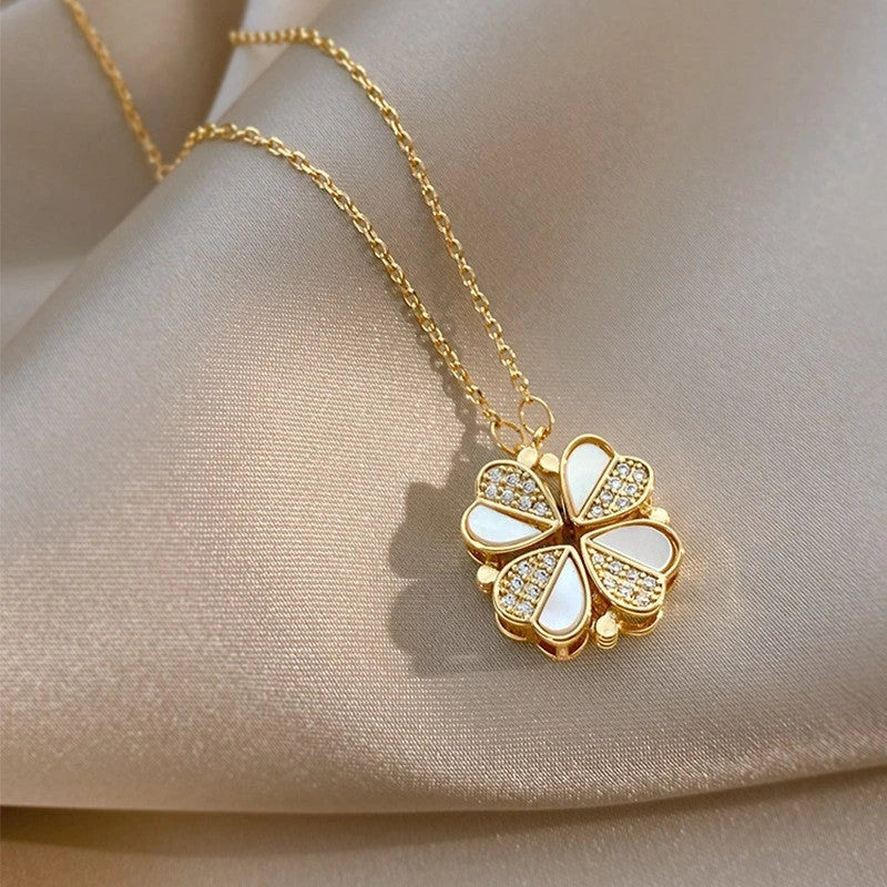 Exclusive four-leaf clover pendant necklace in stainless steel with crystal heart charm, a versatile jewellery piece for women