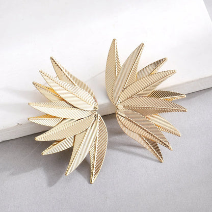 Gold and white alloy leaf-shaped patch earrings with botanical design