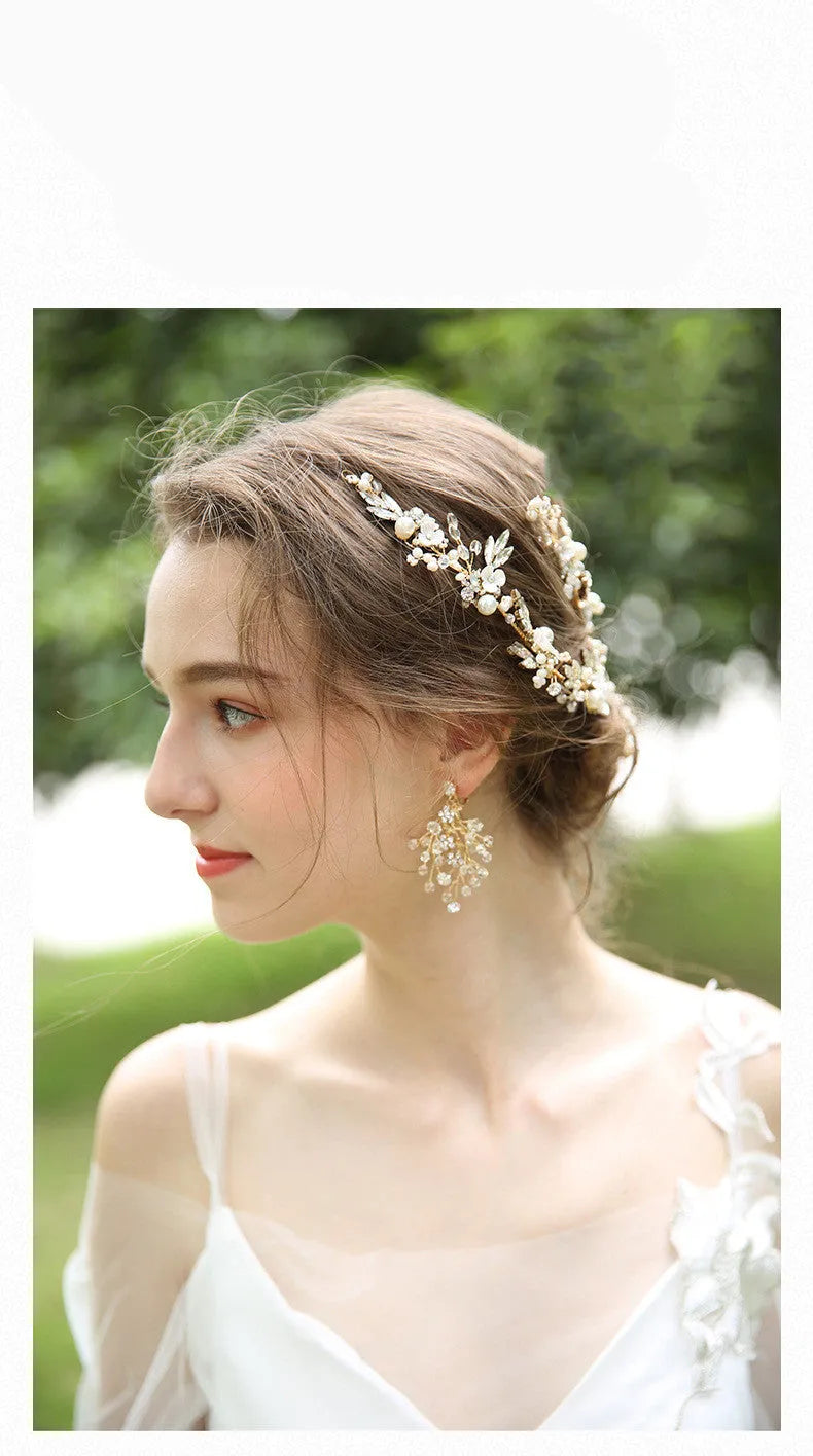 Gold bridal hair clip 27 x 13cm and earrings 6.5 x 4cm with rhinestone, crystal and imitation pearl details.