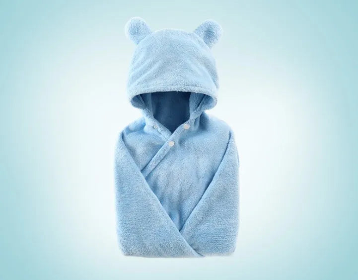 Blue hooded baby bath towel with dimensions 65cm by 110cm laid flat.