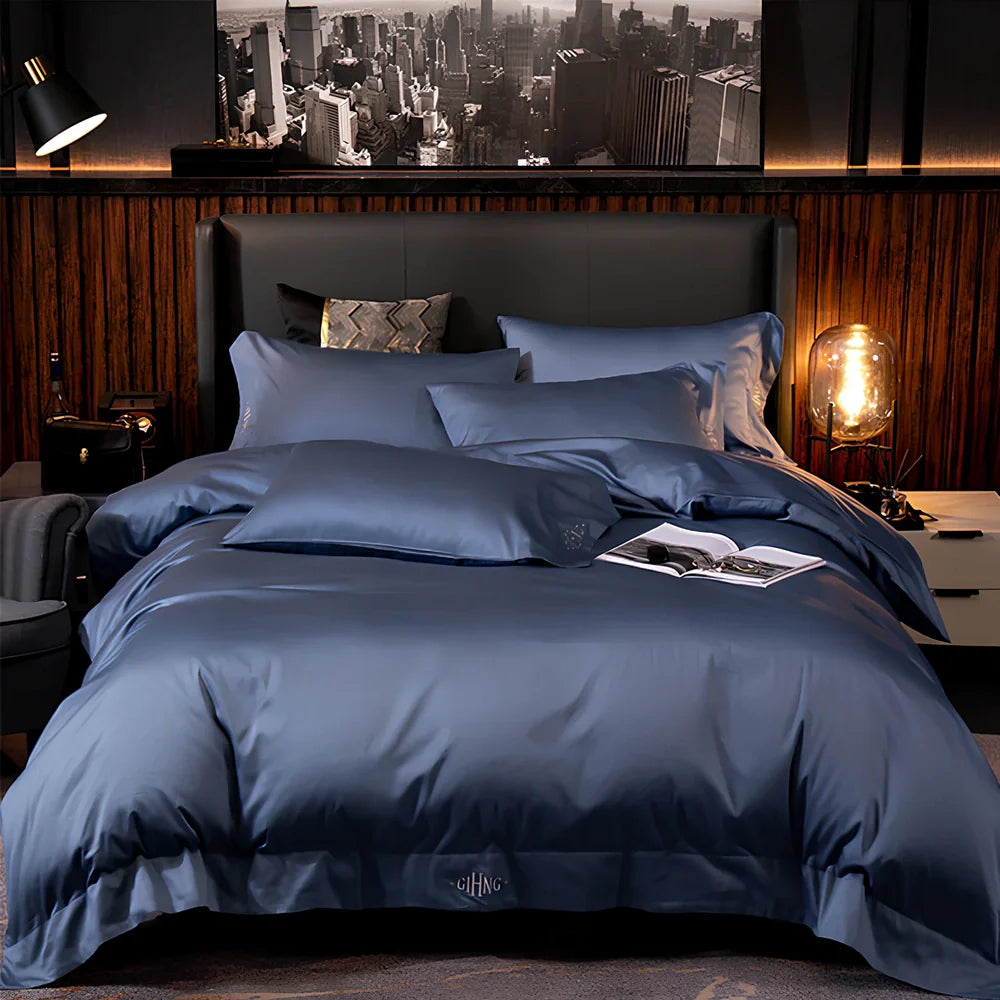 Four-piece cotton bedding set with satin weave fabric showing quilting detail and colour options